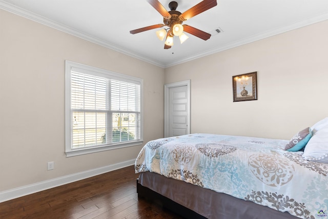 bedroom featuring dark wood-type flooring, ceiling fan, and ornamental molding