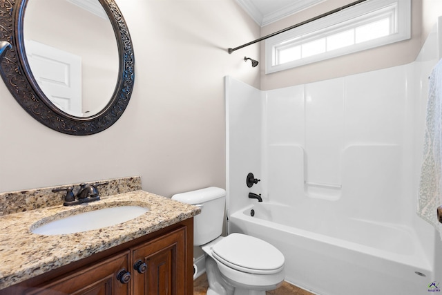 full bathroom featuring vanity, shower / bathing tub combination, ornamental molding, and toilet