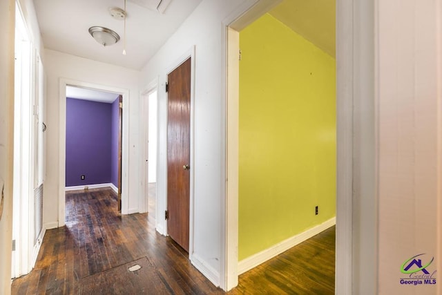 hall with dark hardwood / wood-style floors