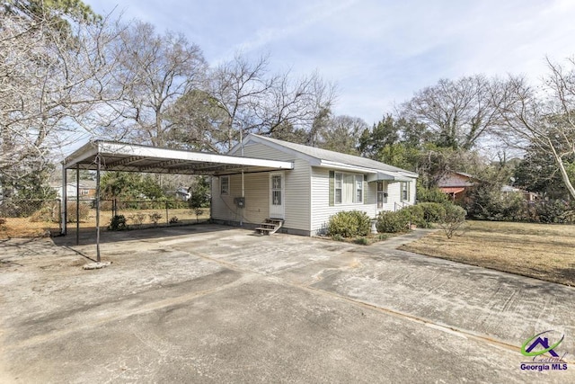 view of side of property featuring a carport