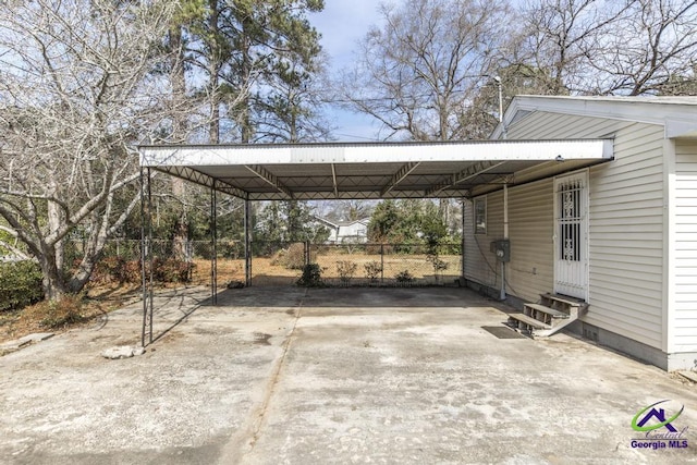 view of vehicle parking featuring a carport