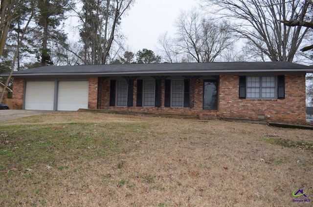 single story home with a garage and a front lawn