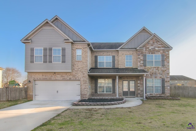 view of front facade with a garage and a front lawn