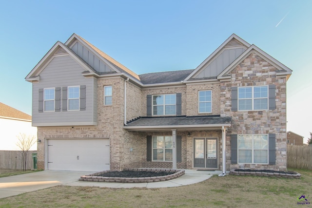 view of front of home with a garage and a front yard