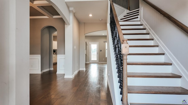 staircase with hardwood / wood-style floors