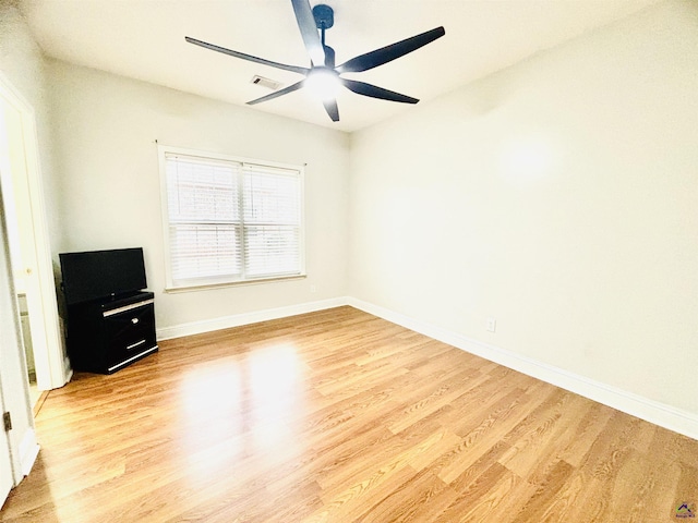 empty room featuring ceiling fan and light wood-type flooring