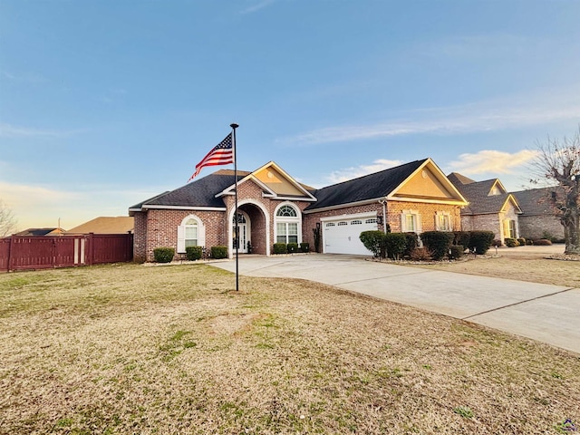 ranch-style home with a garage and a front yard