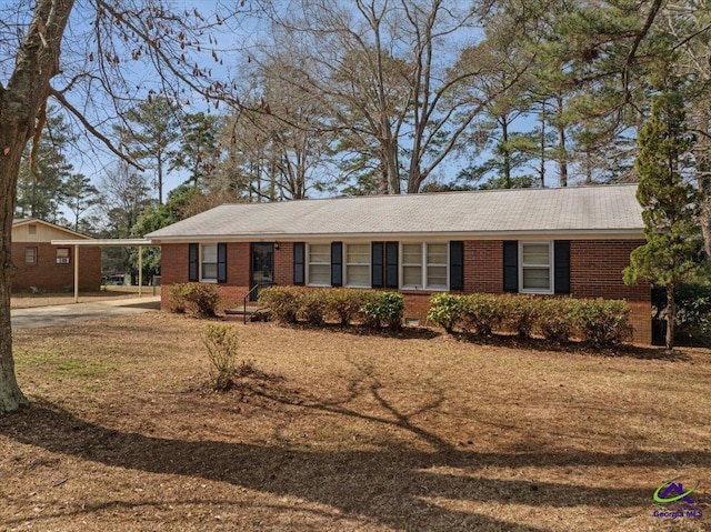 ranch-style home with a carport