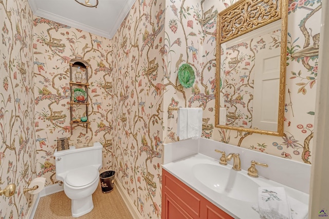 bathroom with crown molding, vanity, and toilet