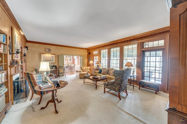 living room featuring ornamental molding and light carpet