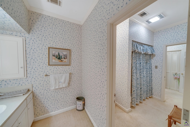 bathroom featuring ornamental molding and vanity