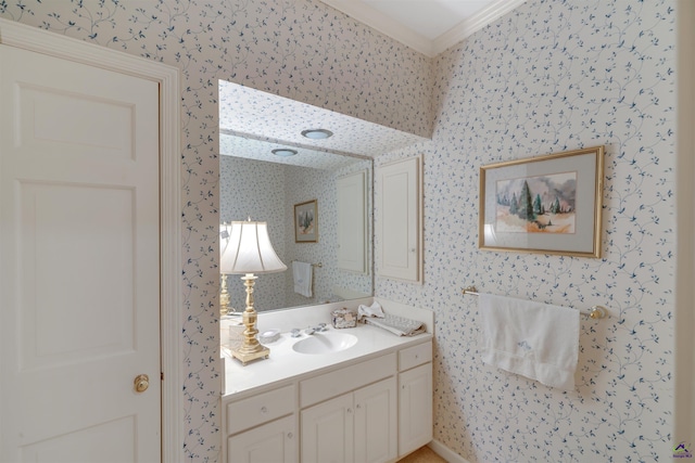 bathroom with ornamental molding and vanity