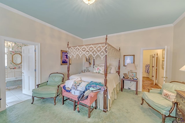 bedroom featuring crown molding, carpet floors, connected bathroom, and a chandelier