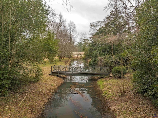 view of gate with a water view