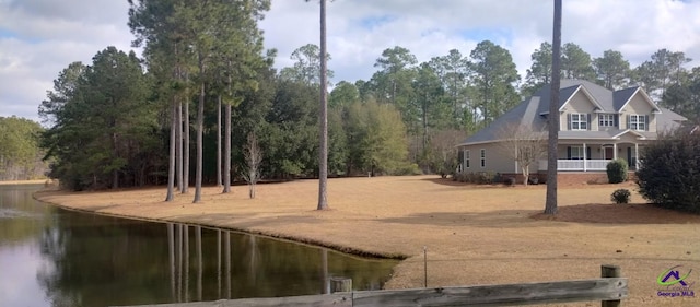 exterior space with a water view