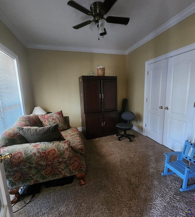 sitting room with crown molding, ceiling fan, and carpet flooring