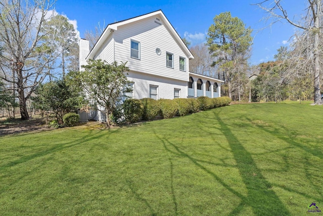 back of house with a yard