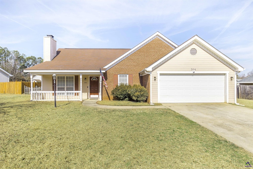 ranch-style home featuring a garage, covered porch, and a front lawn