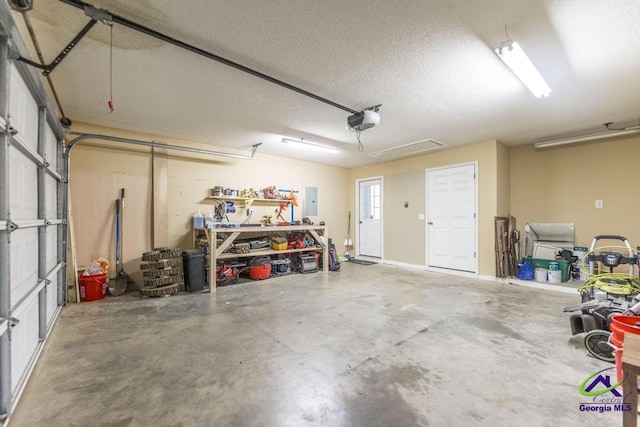 garage featuring a garage door opener and electric panel