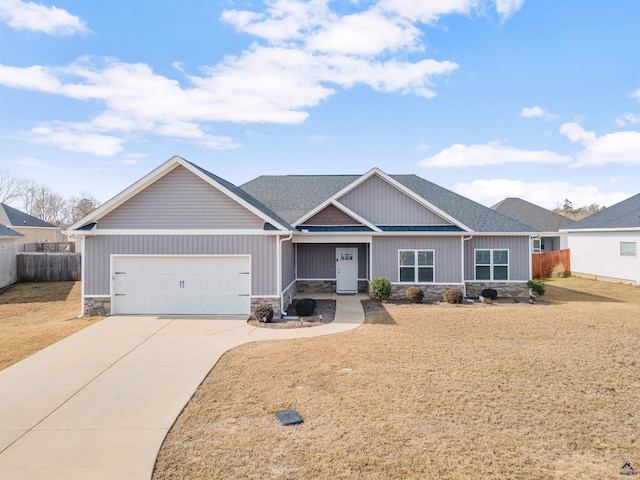 view of front of property with a garage and a front yard