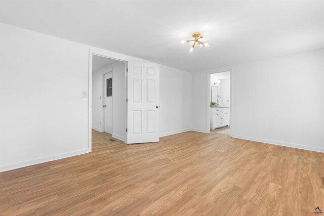 unfurnished room featuring light hardwood / wood-style floors