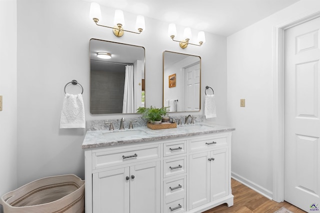 bathroom featuring vanity and wood-type flooring