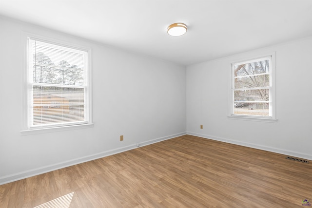 empty room featuring hardwood / wood-style flooring