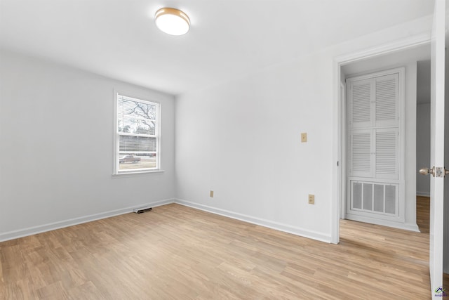 unfurnished room with light hardwood / wood-style floors