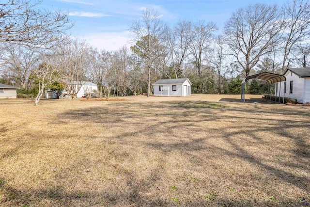 view of yard featuring a storage shed and a carport