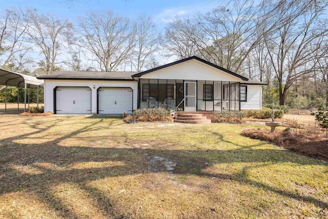 view of front of home with a garage, a front yard, a carport, and a sunroom