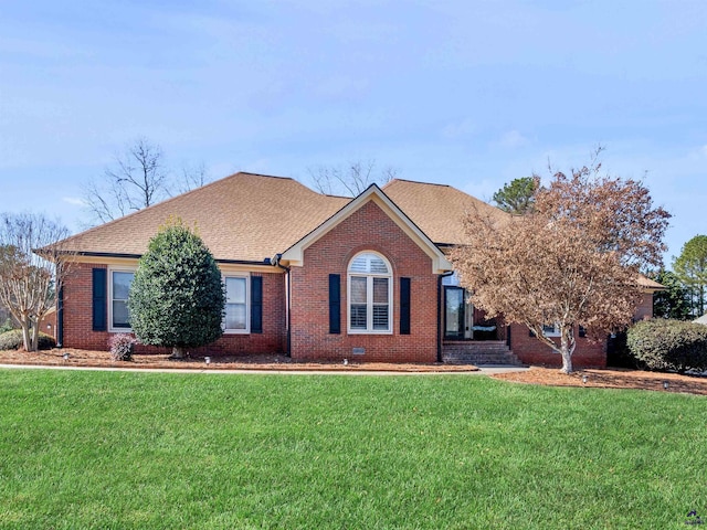 single story home featuring a front lawn