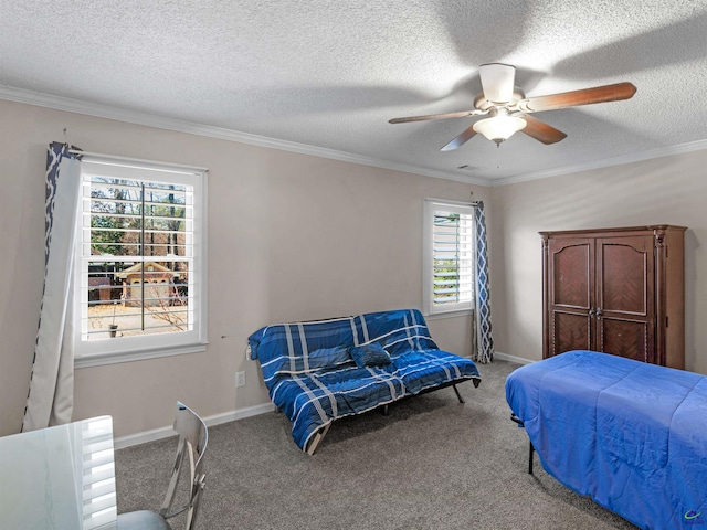 bedroom featuring crown molding, carpet flooring, and ceiling fan