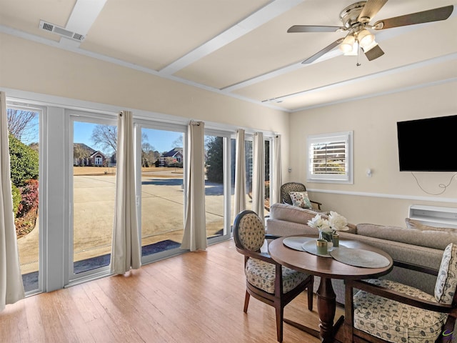 living room featuring ceiling fan and light hardwood / wood-style floors