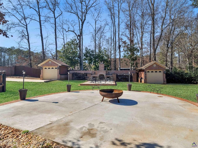 view of patio / terrace with a garage and an outdoor structure