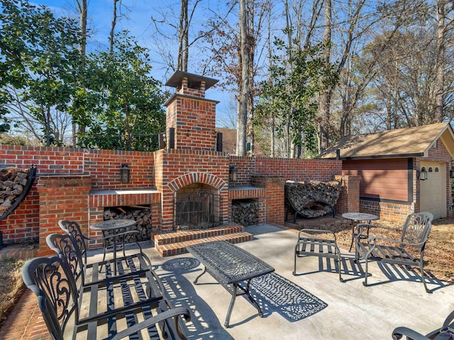 view of patio / terrace featuring an outdoor brick fireplace