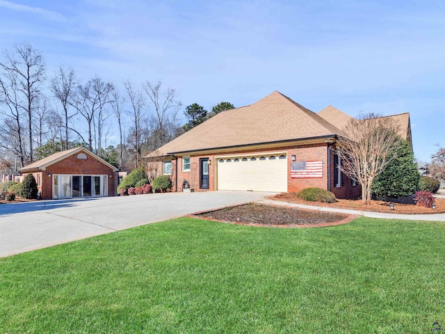 view of front of house featuring a garage and a front yard