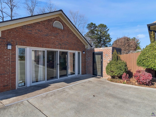 view of side of home with a patio