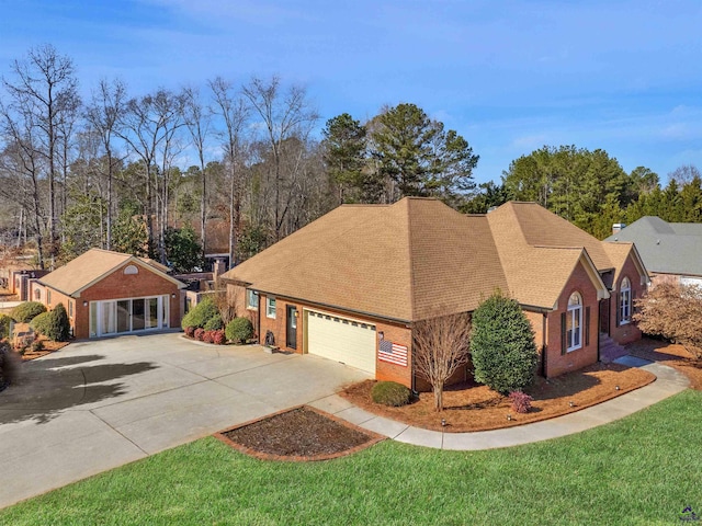 view of front of home featuring a garage and a front lawn