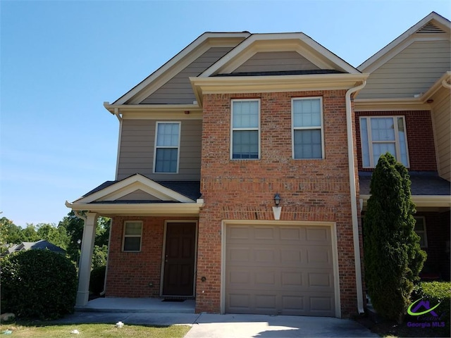 view of front of property with a garage and a porch