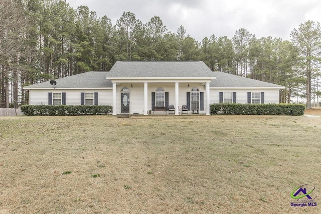 ranch-style home featuring a porch and a front lawn