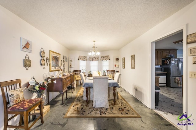 dining area with a notable chandelier and a textured ceiling