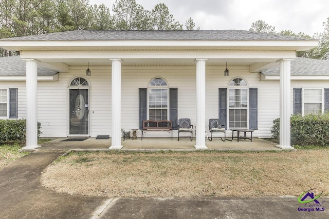 property entrance with a porch