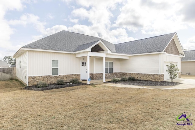 craftsman-style house with a garage and a front yard