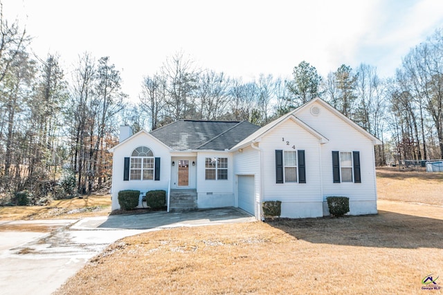 ranch-style home featuring a garage and a front yard