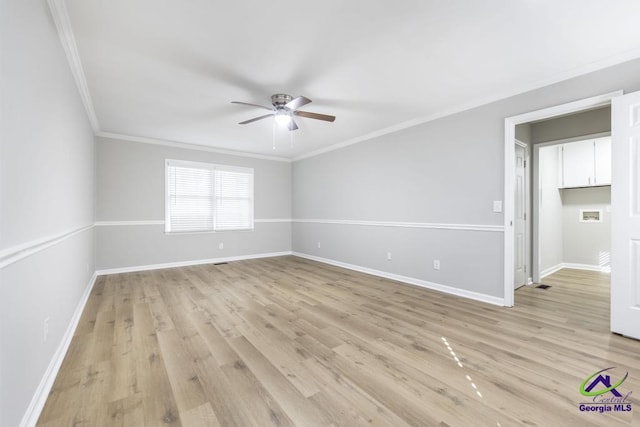 unfurnished room with crown molding, ceiling fan, and light wood-type flooring