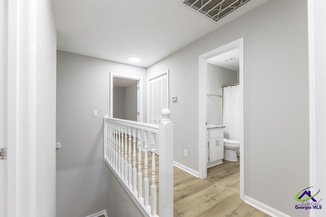 hallway with light wood-type flooring