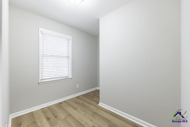 unfurnished room featuring light wood-type flooring