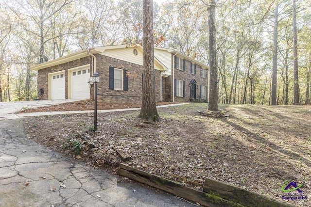 view of property exterior with a garage