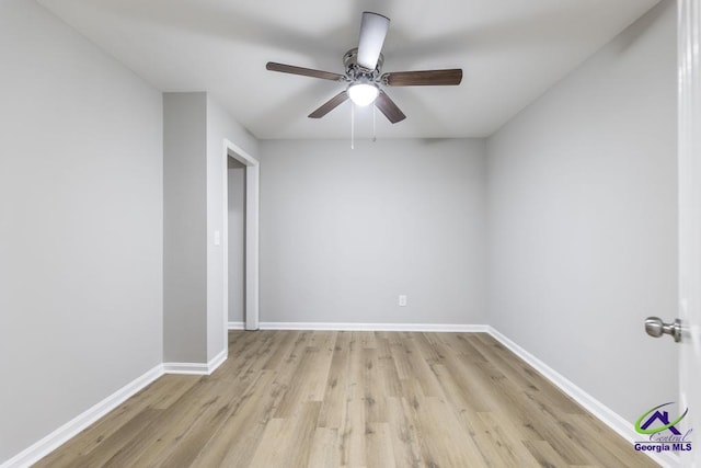 spare room with ceiling fan and light hardwood / wood-style flooring