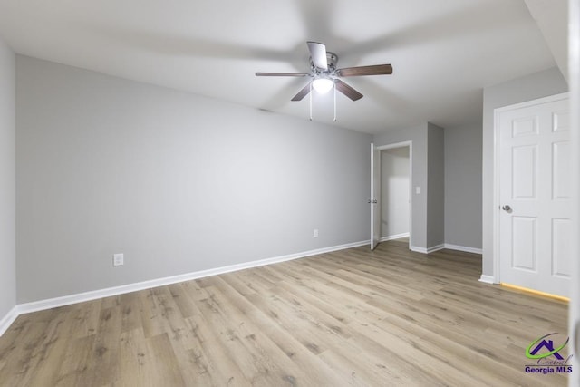 unfurnished bedroom with ceiling fan and light wood-type flooring